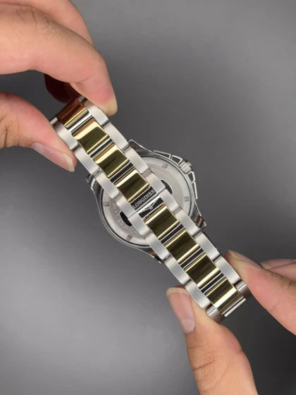 ساعت مچی لونژین کورنوگراف صفحه سرمه ای بند سیلور طلایی Longines