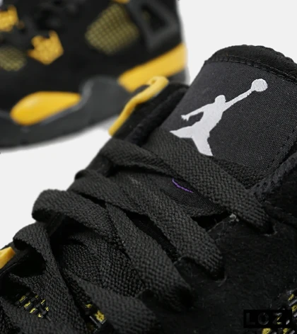 کفش کتانی ساق‌دار مردانه مشکی زرد Nike air jordan 4