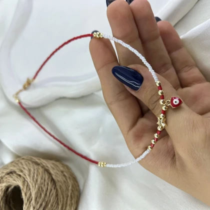 گردنبند زنانه مهره‌ای مدل آرزو طرح ستاره و چشم نظر