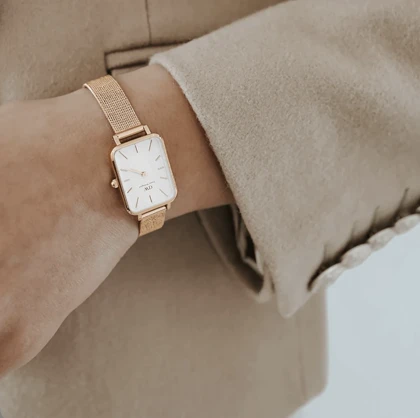 ساعت دنیل ولینگتون حصیری زنانه رزگلد صفحه مستطیل سفید Daniel Wellington Rosegold