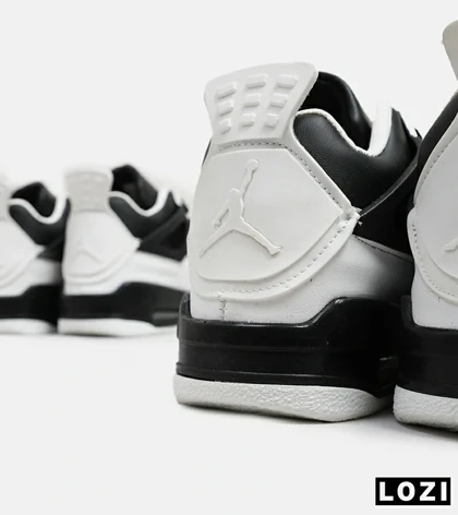 کتانی ساق‌دار بزرگ پا سفید مشکی Nike air jordan 4