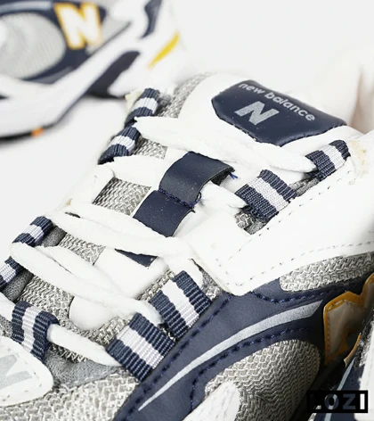 کفش کتانی مردانه و زنانه طوسی زرد مشکی NEW BALANCE 725