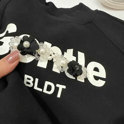 بلوز دخترانه لاینردار مشکی مرواریدی CONTLE