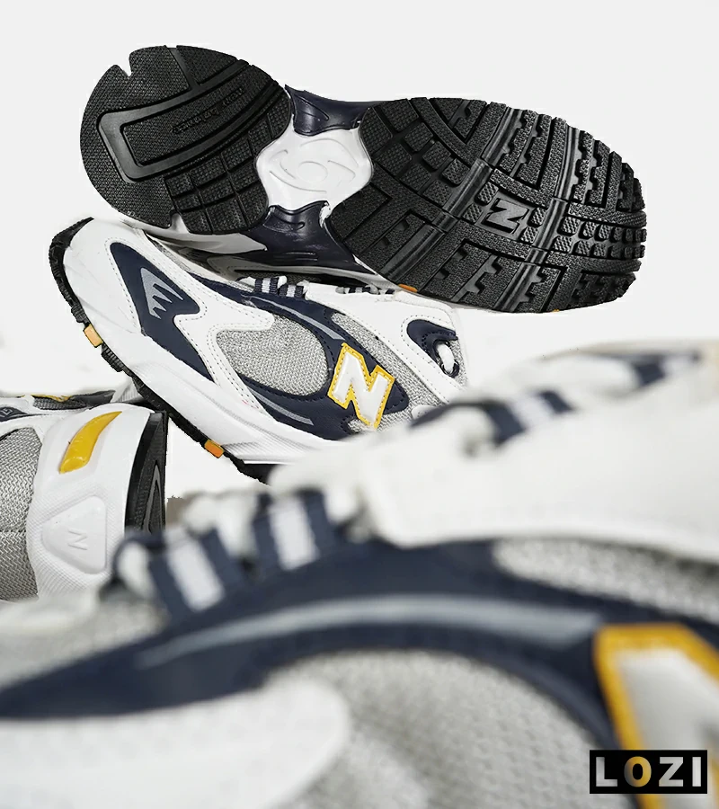 کفش کتانی مردانه و زنانه طوسی زرد مشکی NEW BALANCE 725 مدل 7387